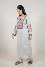 Raysham Fashion beige linen kurta set with intricate blue, orange, and brown floral embroidery on neckline and sleeves.