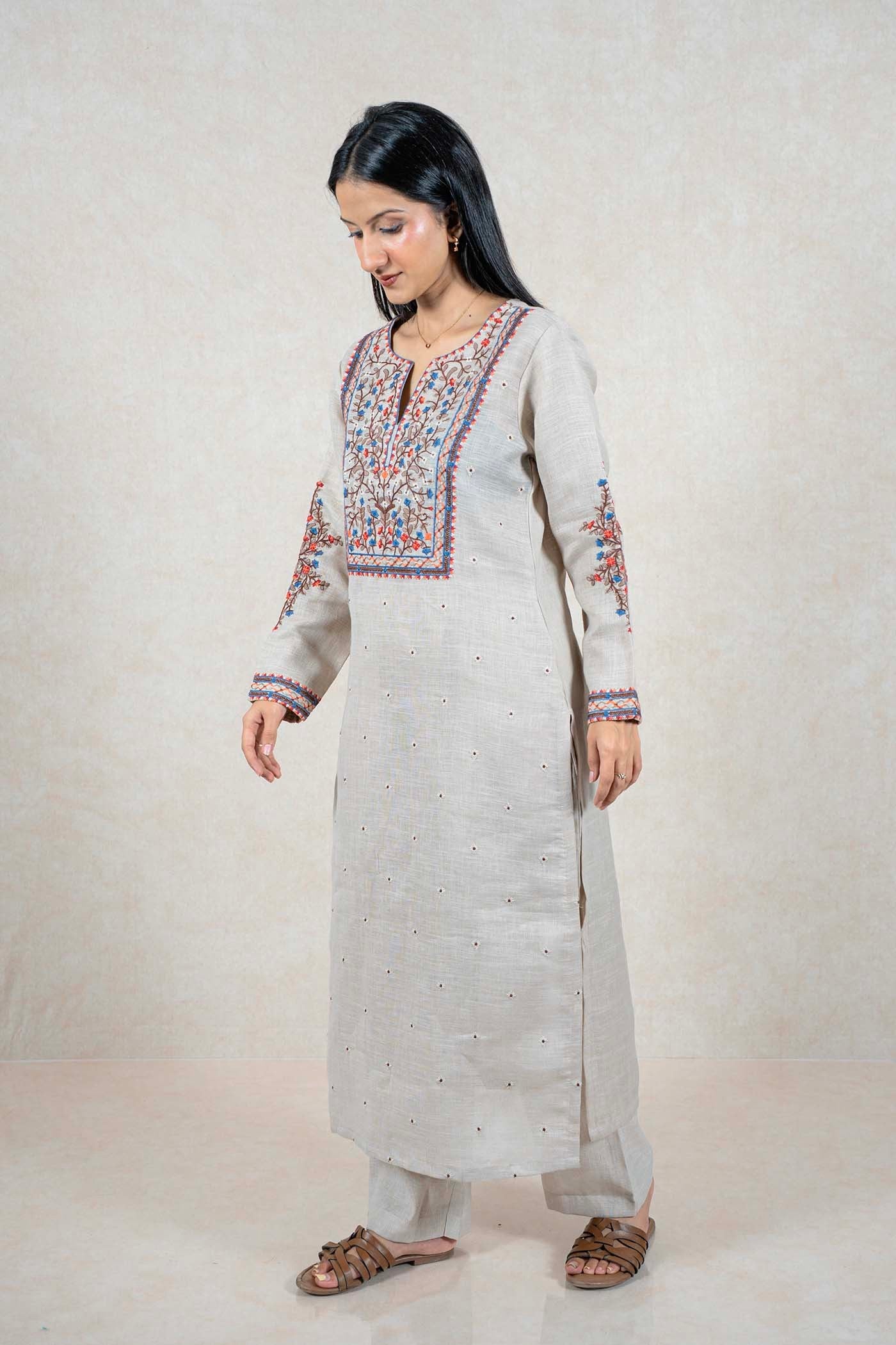 Raysham Fashion beige linen kurta set with intricate blue, orange, and brown floral embroidery on neckline and sleeves.