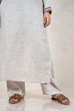 Raysham Fashion beige linen kurta set with intricate floral embroidery on sleeves and scattered motifs on the body