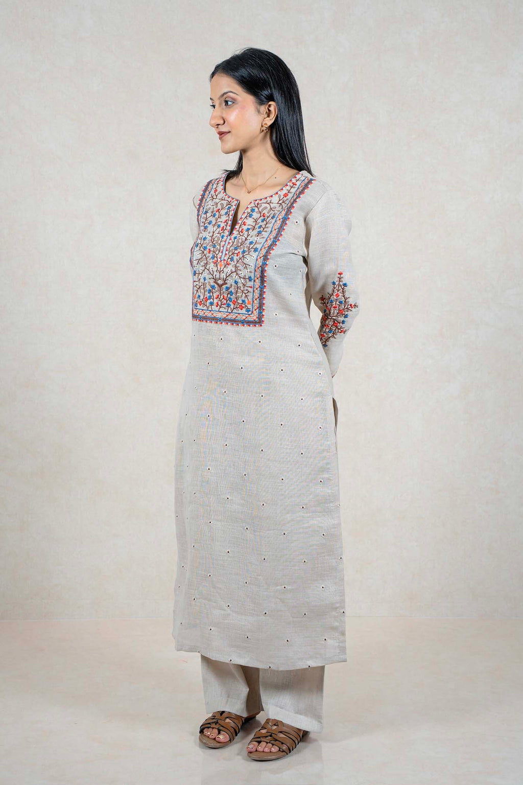 Raysham Fashion beige linen kurta set with intricate blue, orange, and brown floral embroidery on neckline and sleeves