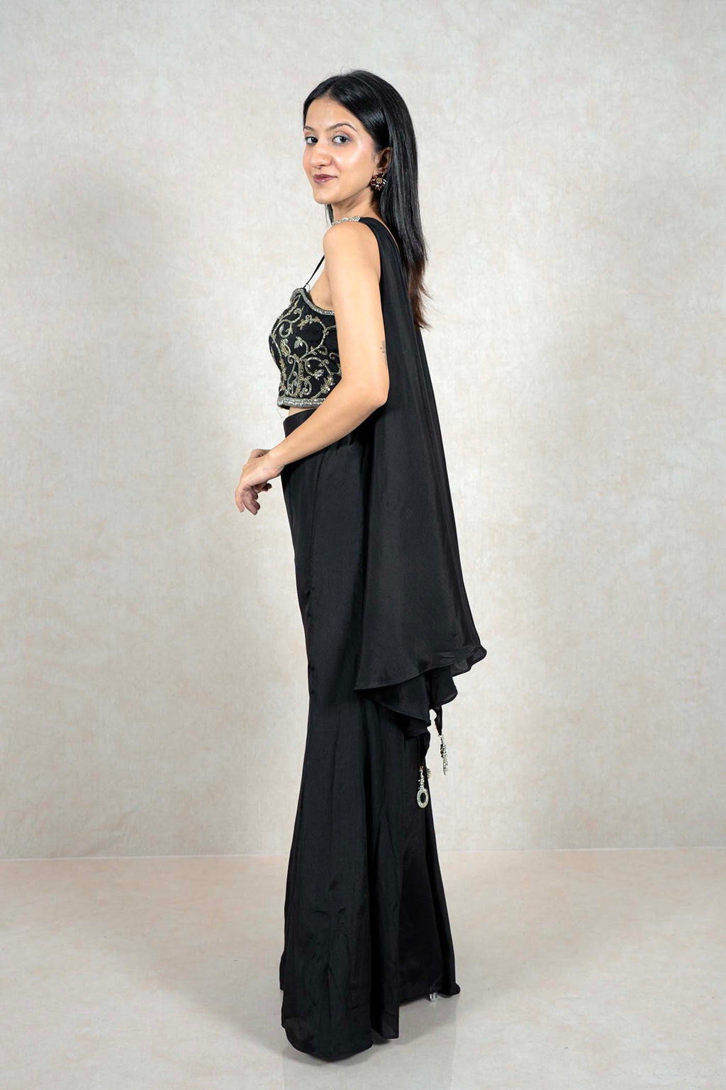 Raysham Fashion black co-ord set with embroidered crop top, wide-leg trousers, and a side drape, side view.