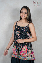 Raysham Fashion black sleeveless peplum top with vibrant hand-painted cultural motifs and delicate floral print