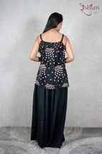 Raysham Fashion black sleeveless peplum top with floral print and hand-painted hem paired with wide leg trousers