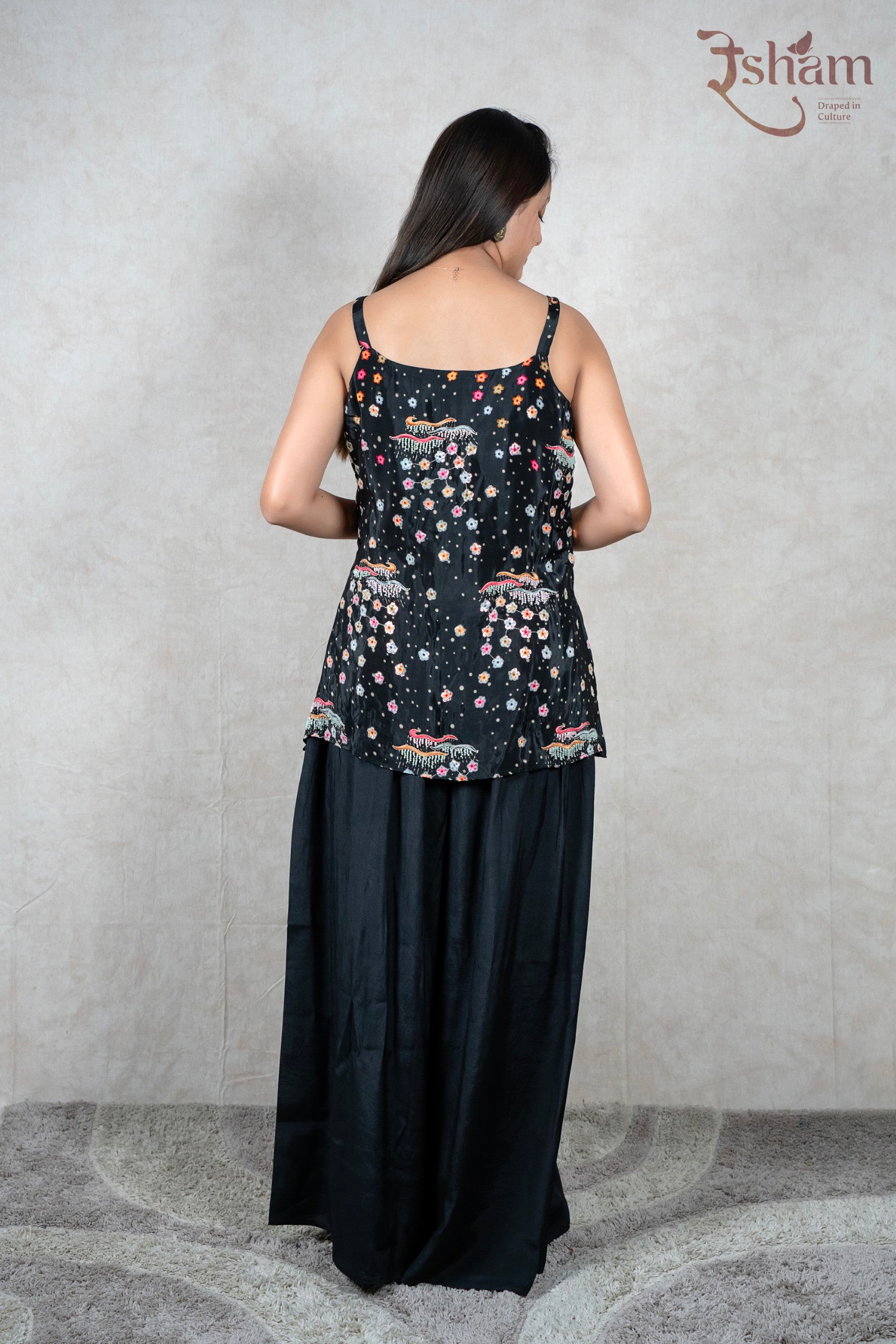 Raysham Fashion black sleeveless peplum top with floral print and hand-painted hem paired with wide leg trousers