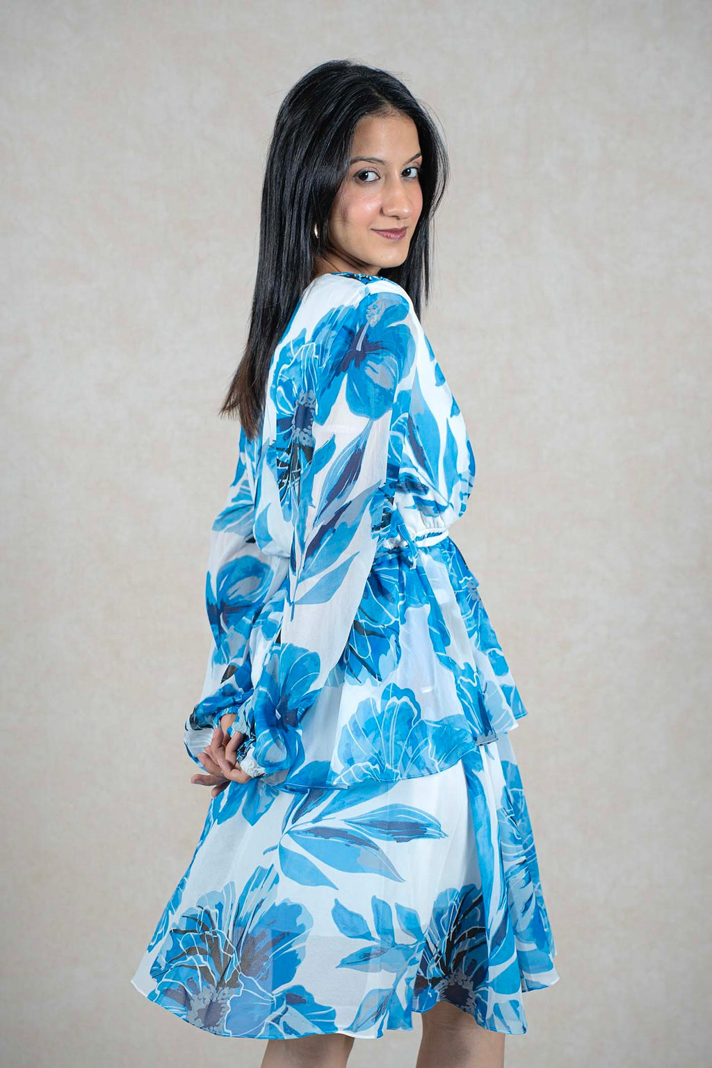 Raysham Fashion blue and white floral print long sleeve wrap dress with a tiered skirt on a model