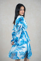 Raysham Fashion blue and white floral print long sleeve wrap dress with a tiered skirt on a model