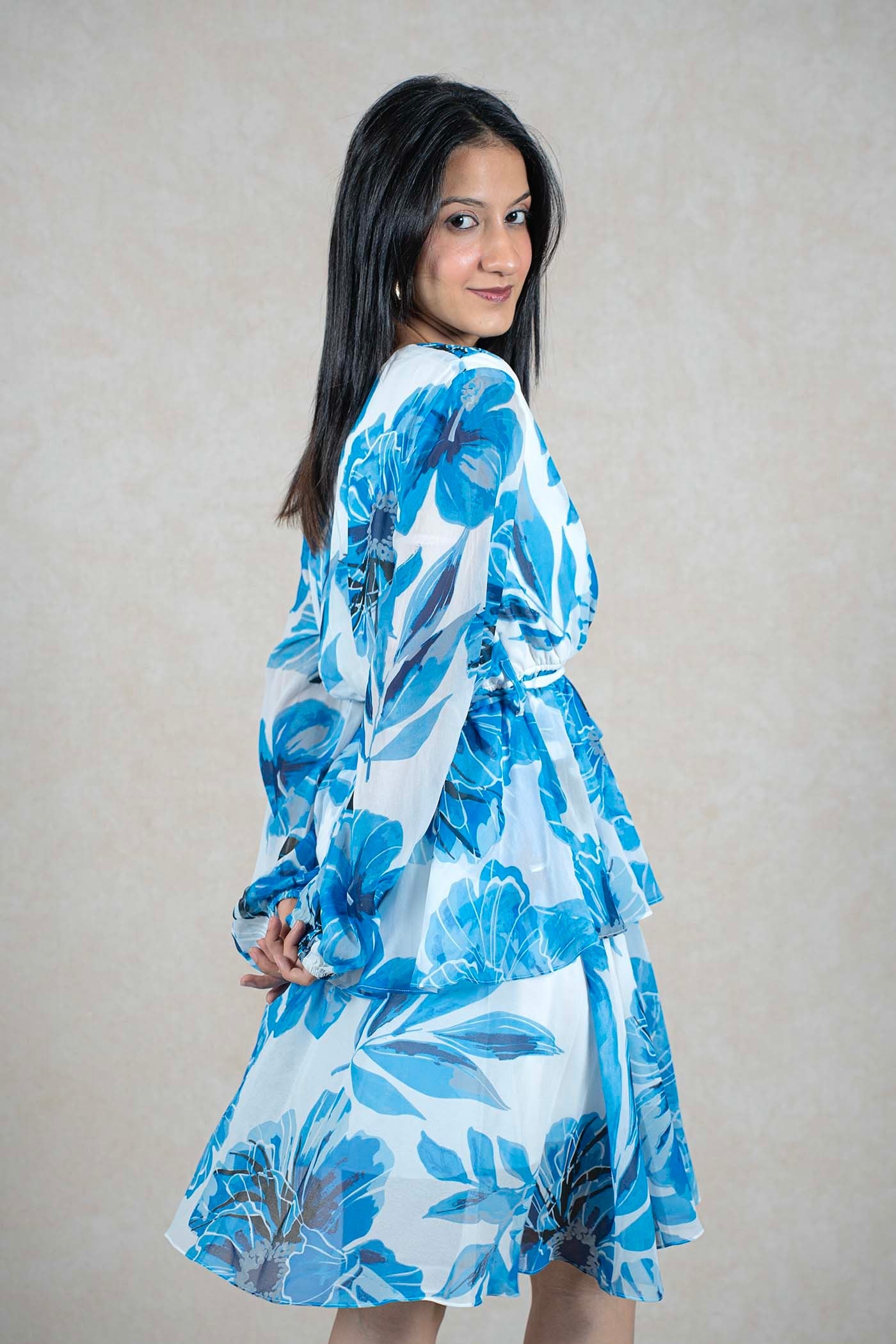 Raysham Fashion blue and white floral print long sleeve wrap dress with a tiered skirt on a model