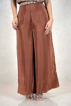 Raysham Fashion chocolate brown wide-leg trousers with an embellished waistband worn with matching sandals