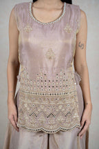 Raysham Fashion champagne sleeveless kurta with intricate mirror work, embroidery, and a scalloped hemline.