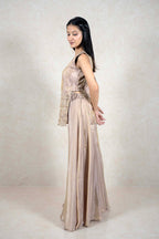 Raysham Fashion champagne sleeveless kurta with mirror work and wide-leg palazzo pants on a model, side profile view.