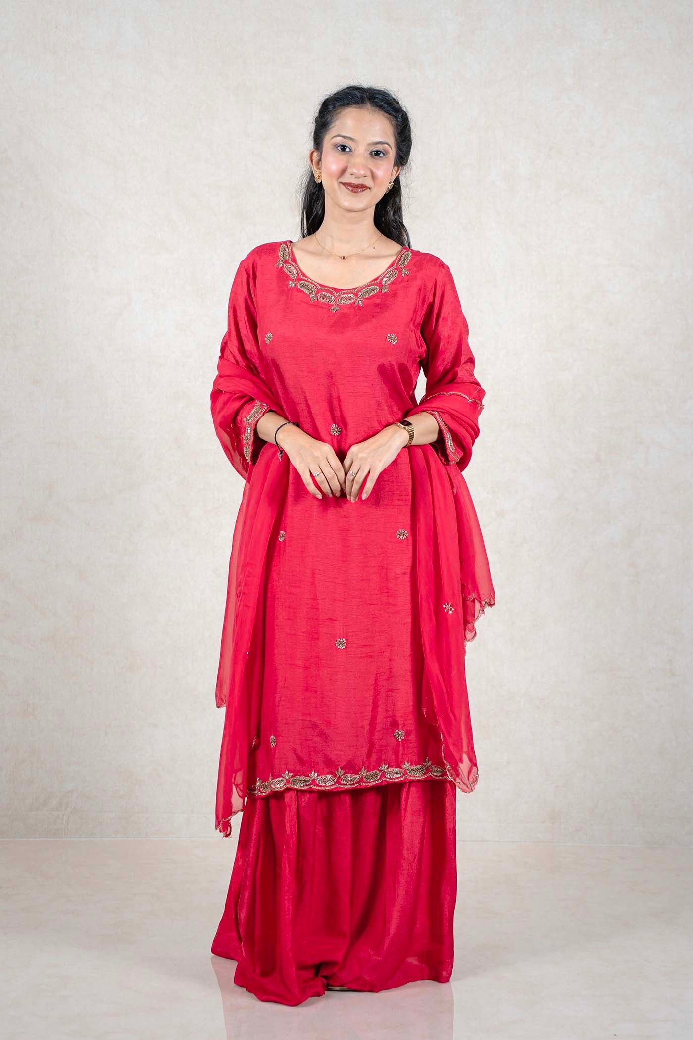 Raysham Fashion crimson red silk-blend kurta set with gold embroidery, matching dupatta, and wide-leg trousers.