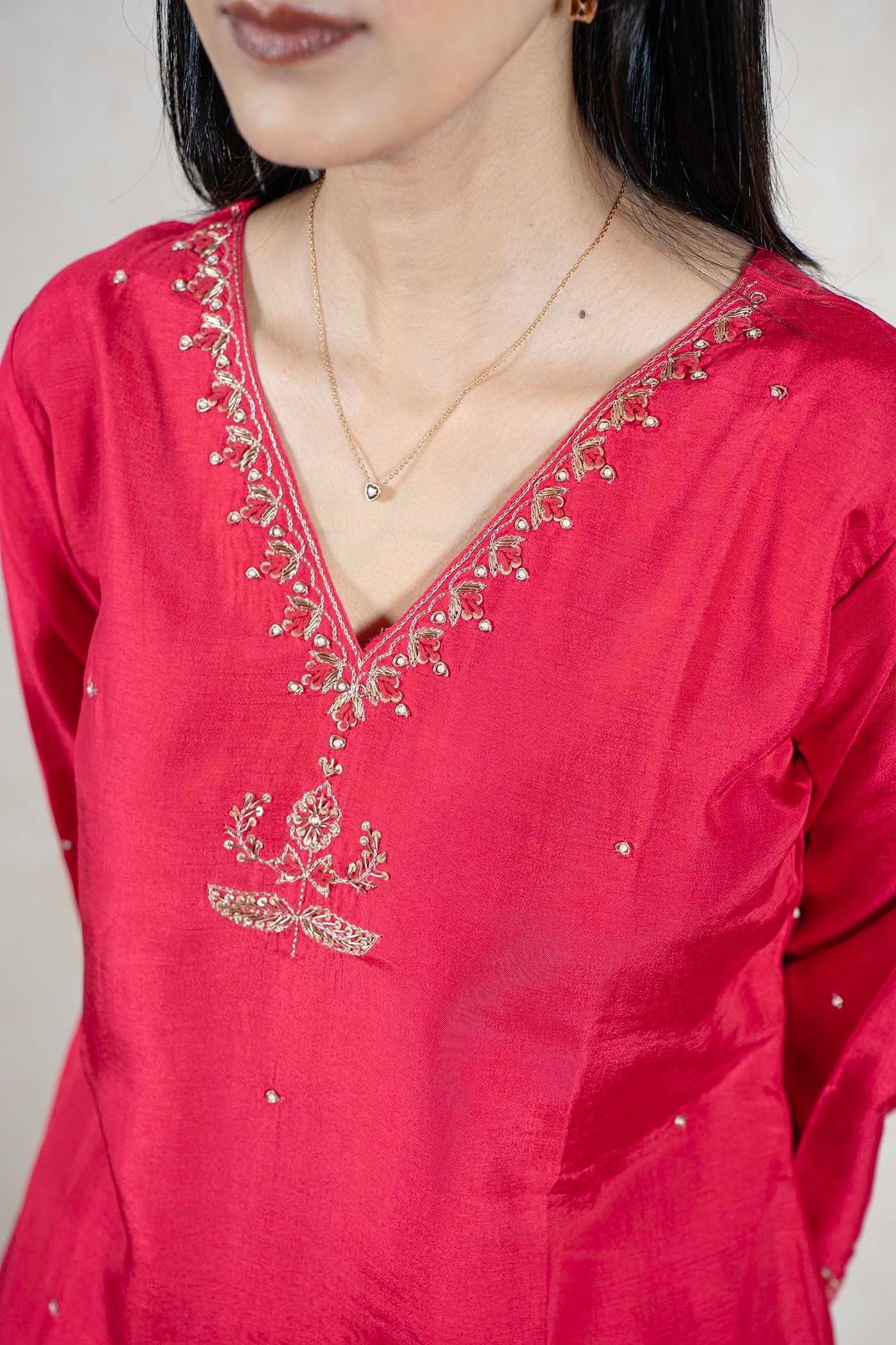 Raysham Fashion crimson red silk-blend kurta featuring intricate gold-toned embroidery and embellishments on the V-neck