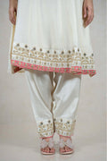 Raysham Fashion off-white silk-blend kurta set with coral floral embroidery, mirror work, and scalloped hem details.