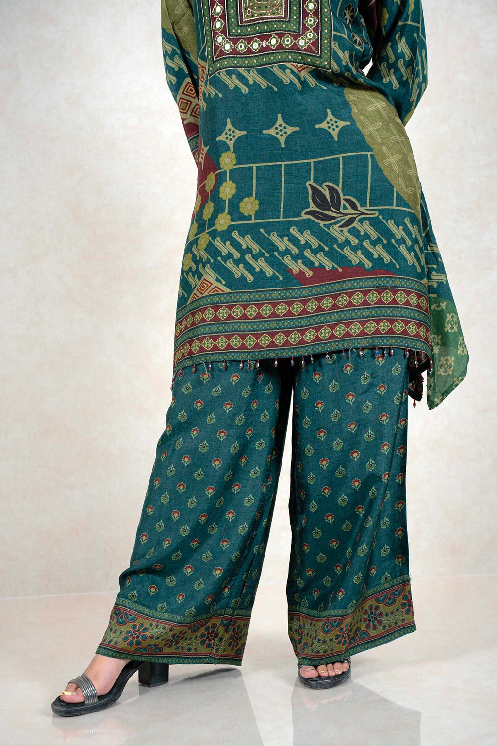 Raysham Fashion emerald green printed kurta and wide-leg pant set with mirror work and geometric patterns