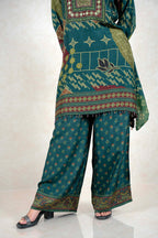 Raysham Fashion emerald green printed kurta and wide-leg pant set with mirror work and geometric patterns