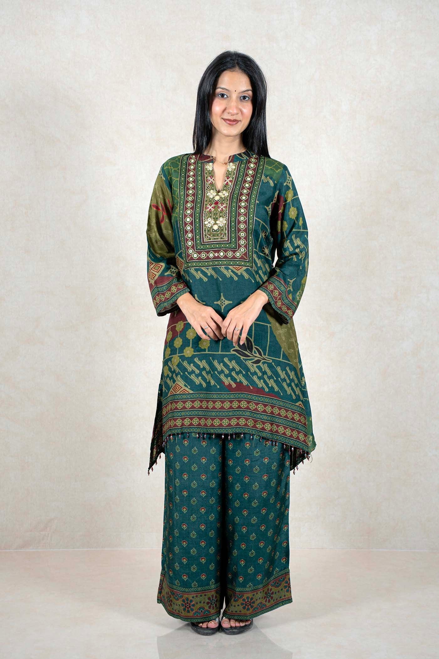 Raysham Fashion emerald green printed kurta and wide-leg pant set with intricate embroidery and mirror work details.