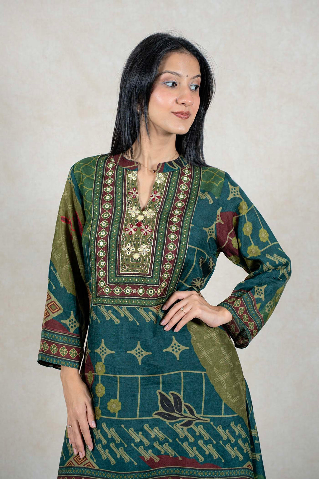 Raysham Fashion emerald green printed kurta with intricate embroidery and mirror work on the neckline