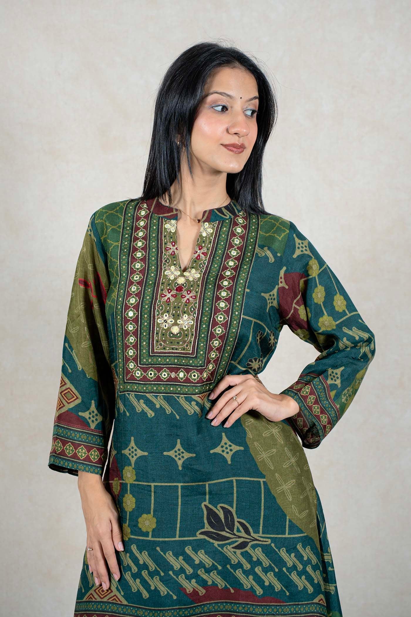 Raysham Fashion emerald green printed kurta with intricate embroidery and mirror work on the neckline