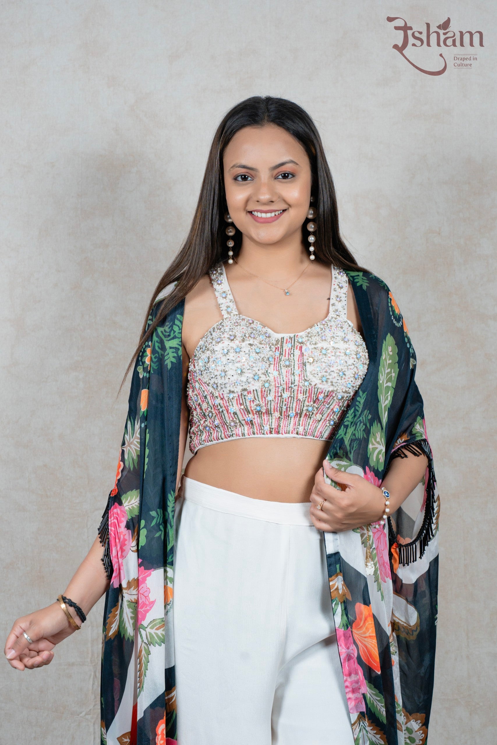 Raysham Fashion floral print cape set featuring an embellished sleeveless blouse and white wide-leg trousers
