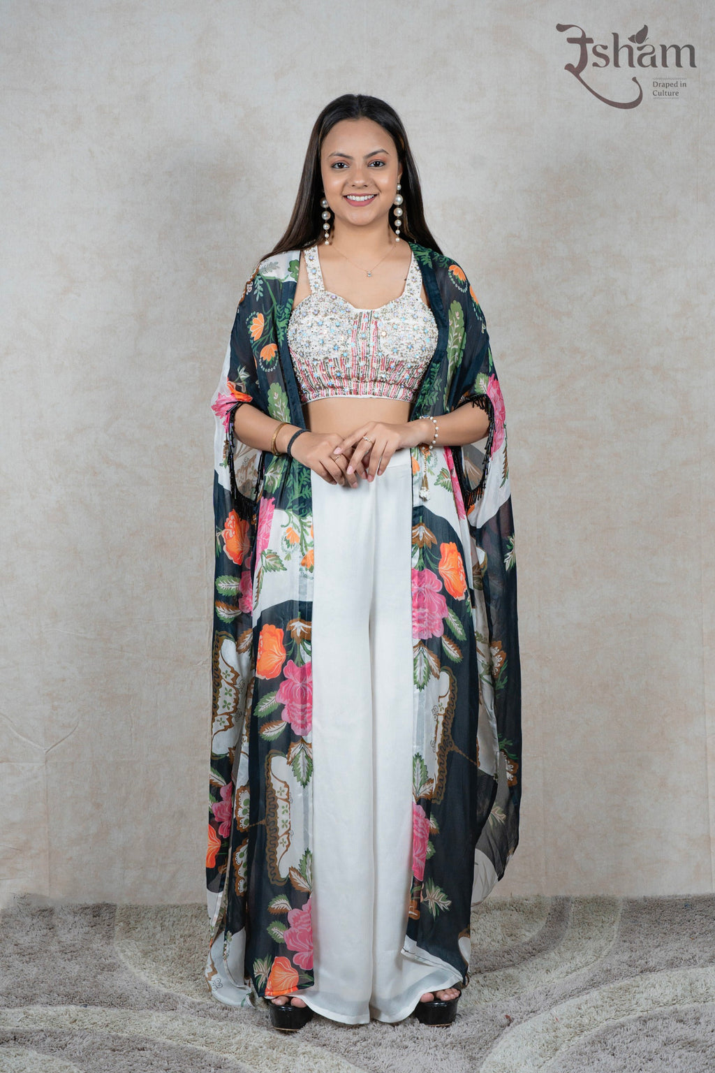 Raysham Fashion floral print cape set featuring an embellished sleeveless blouse and solid white wide-leg trousers.