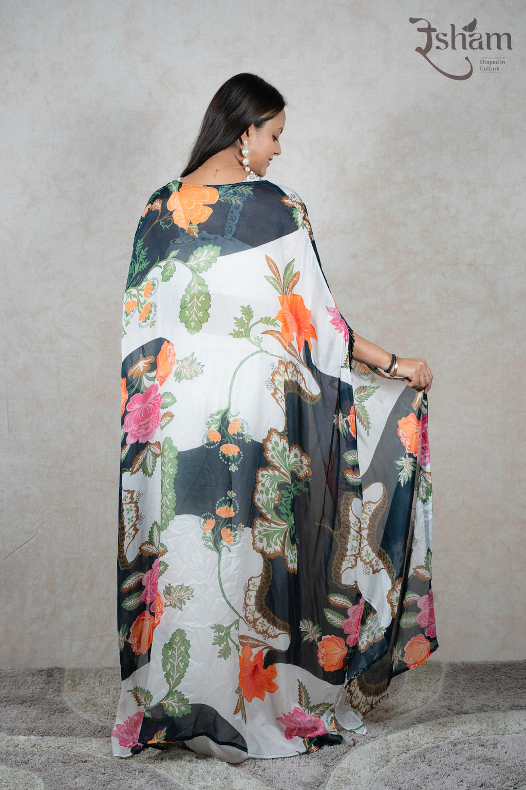 Raysham Fashion floral print sheer cape shrug worn over a white outfit, showcasing vibrant botanical patterns.