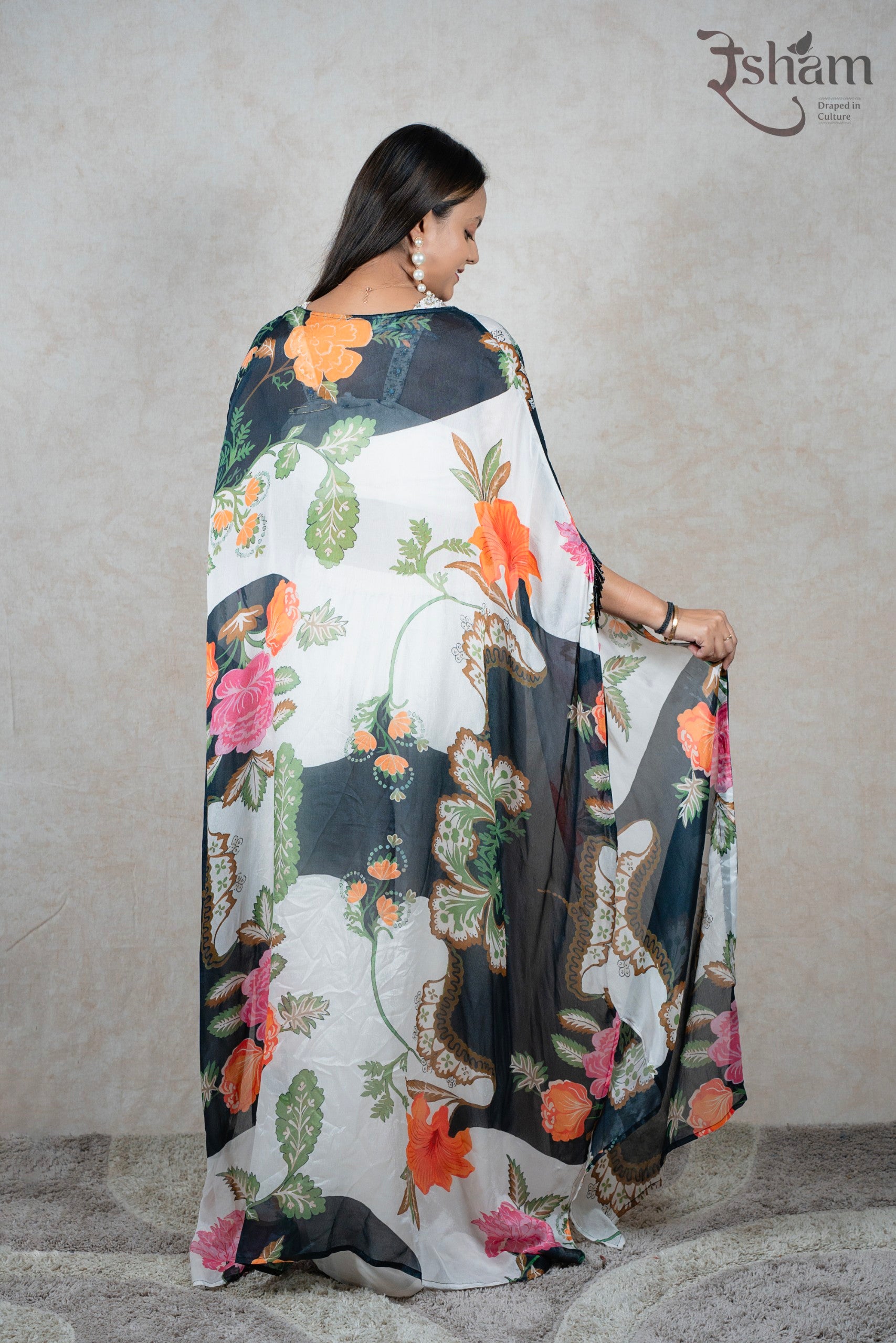 Raysham Fashion floral print sheer cape shrug worn over a white outfit, showcasing vibrant botanical patterns.