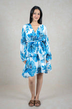 Raysham Fashion blue and white floral print long sleeve wrap dress with a tie waist and tiered skirt on a model