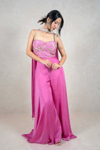 Raysham Fashion fuchsia pink jumpsuit with an embellished corset bodice, gold embroidery, and flowing wide-leg trousers.