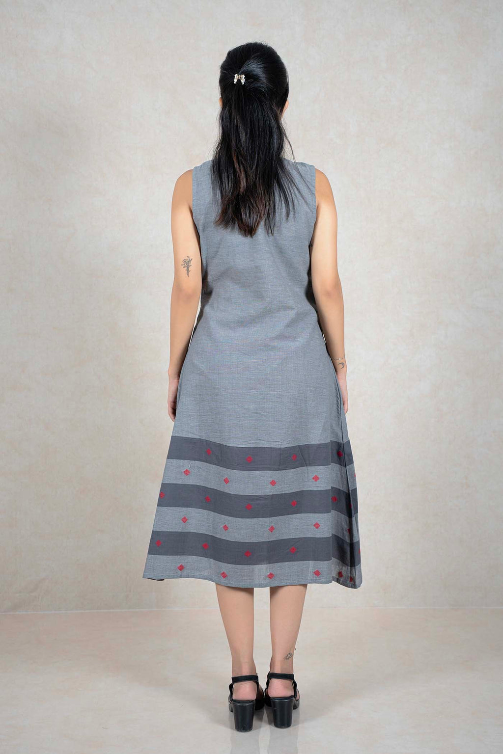 Raysham Fashion grey sleeveless cotton midi dress with a striped hem and red diamond embroidery, back view.