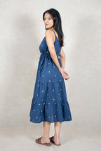 Woman wearing a Raysham Fashion indigo blue cotton tiered midi dress with a square print and drawstring waist