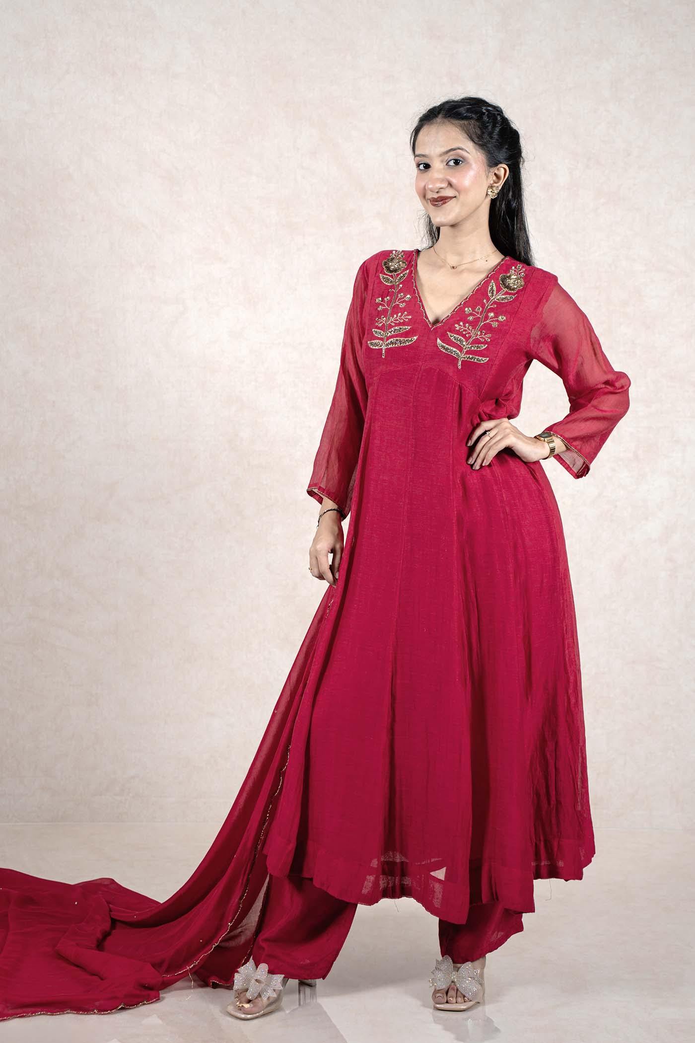 Raysham Fashion deep magenta Anarkali suit with gold floral embroidery, sequin work, and sheer dupatta on a model.