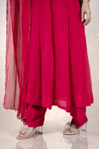 Raysham Fashion deep magenta Anarkali suit with flared kurta, matching trousers, and sheer dupatta with gold trim.