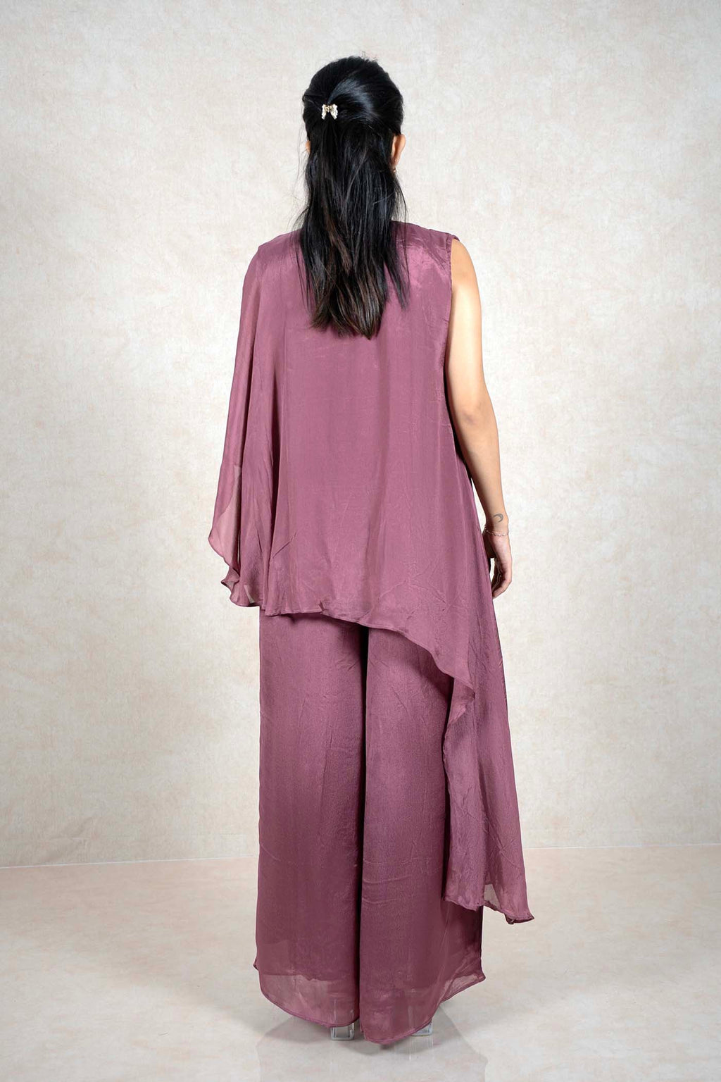 Back view of a Raysham Fashion mauve asymmetrical tunic and wide-leg pants set in lightweight fabric