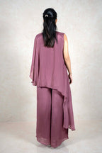 Back view of a Raysham Fashion mauve asymmetrical tunic and wide-leg pants set in lightweight fabric