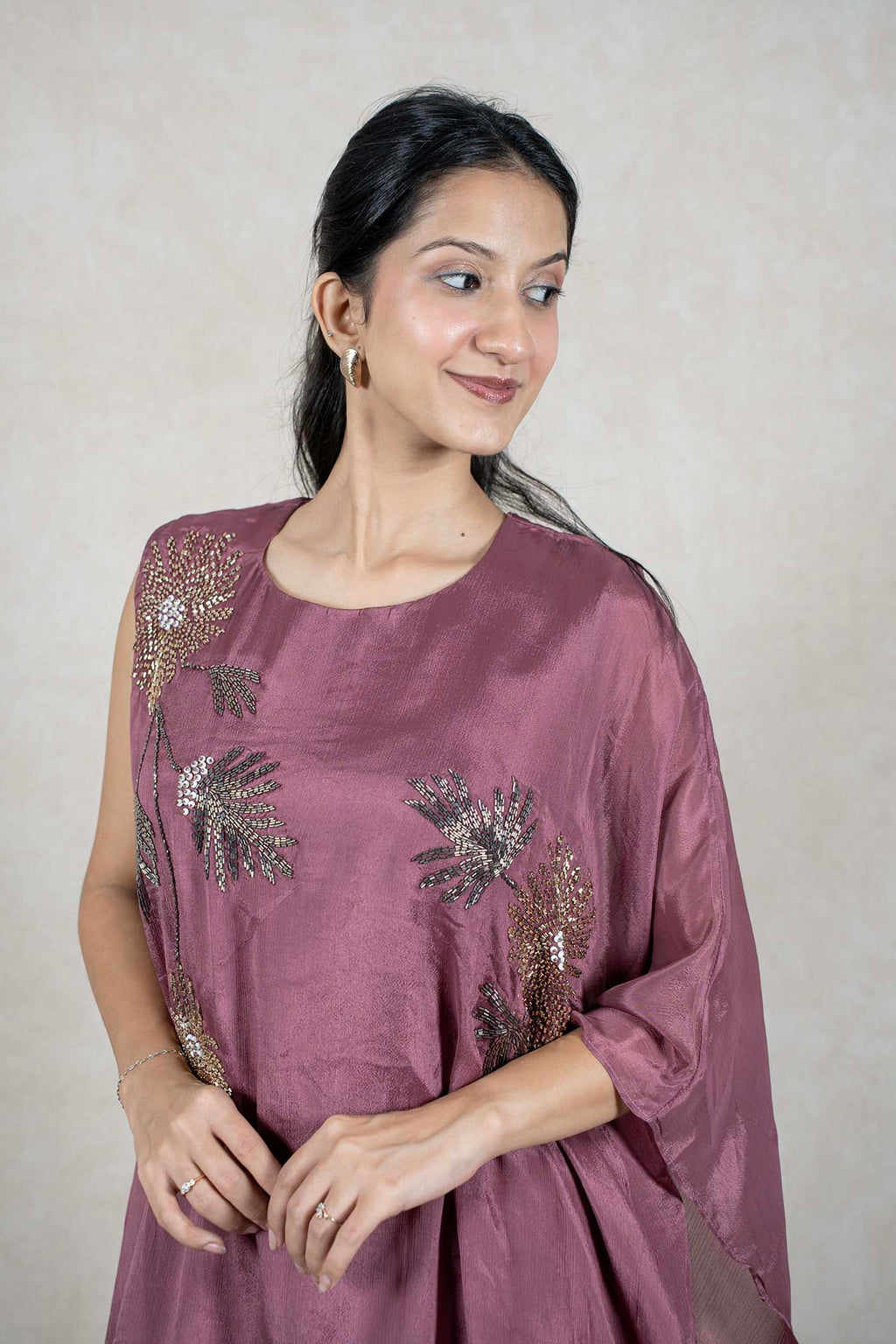 Raysham Fashion mauve asymmetrical tunic with hand-placed floral embroidery, sequins, and beads on lightweight fabric.