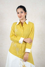Raysham Fashion mustard and white asymmetric shirt dress with floral embroidery, button-down front, and long sleeves.