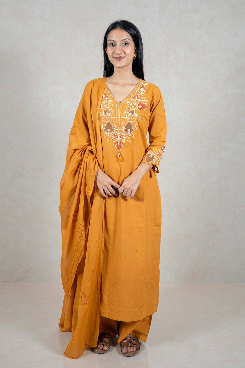 Raysham Fashion mustard yellow cotton kurta set with floral embroidery, wide-leg trousers, and matching dupatta.