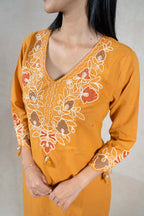 Raysham Fashion mustard yellow cotton kurta with intricate multi-colored floral embroidery and a flattering V-neckline