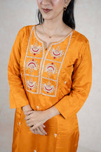 Raysham Fashion mustard yellow silk-blend kurta featuring intricate red and gold embroidery on the neckline