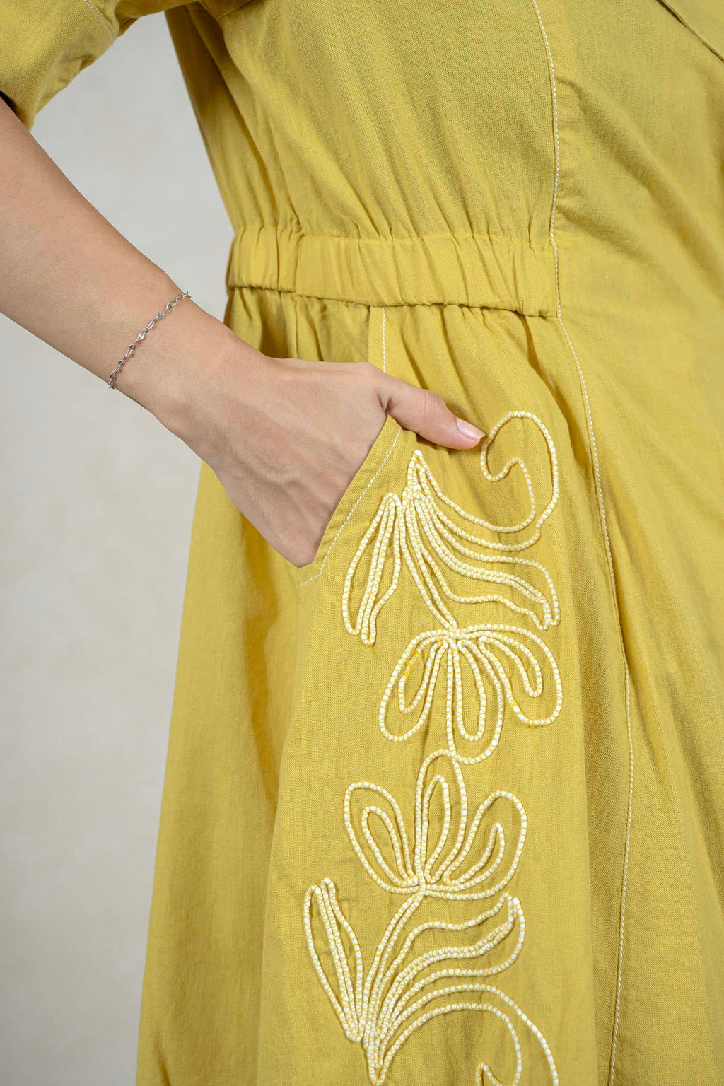 Raysham Fashion mustard yellow midi dress featuring intricate white floral embroidery and a convenient side pocket.