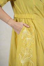 Raysham Fashion mustard yellow midi dress featuring intricate white floral embroidery and a convenient side pocket.