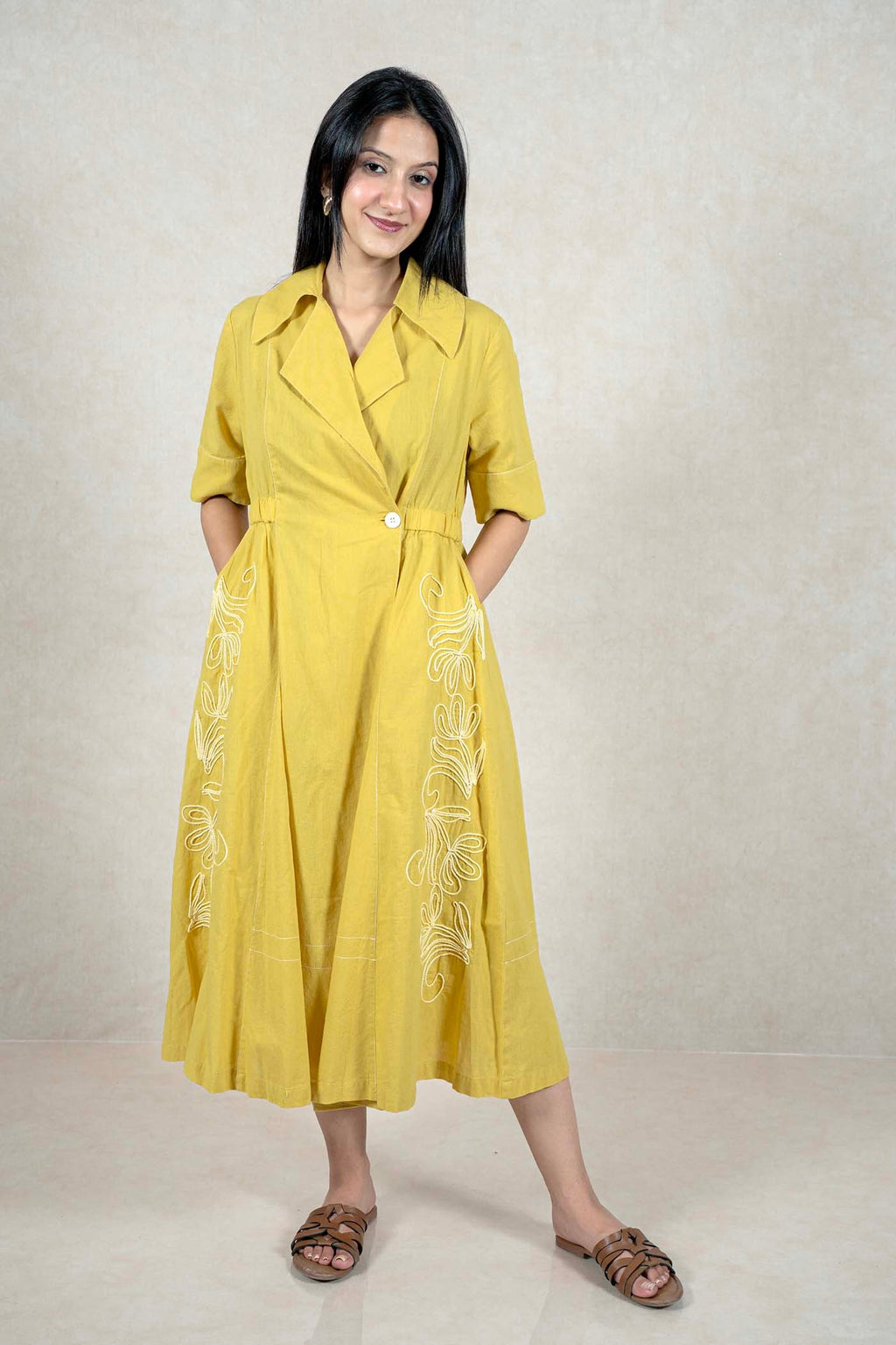 Raysham Fashion mustard yellow midi dress with a lapel collar, wrap bodice, and intricate white side embroidery.