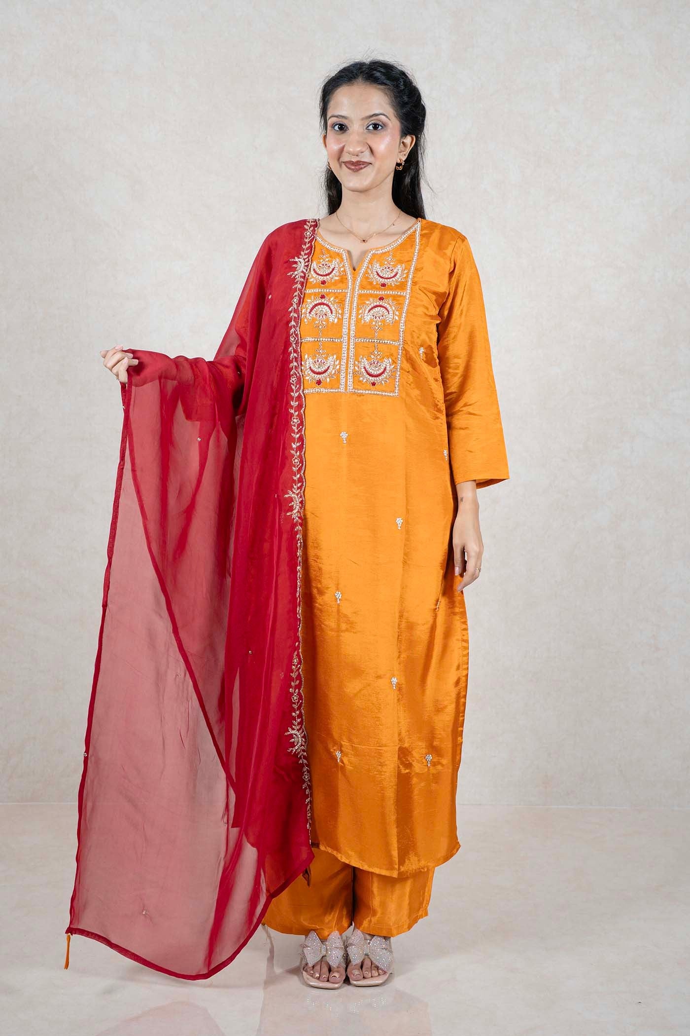 Raysham Fashion mustard yellow silk-blend kurta set with intricate embroidery and a sheer red dupatta on a model