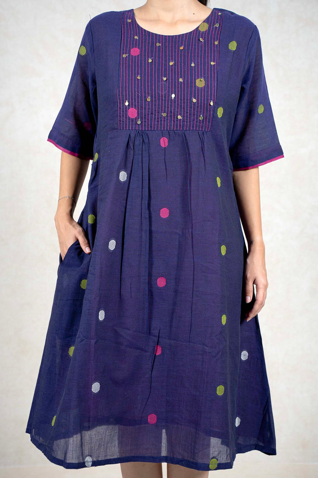 Raysham Fashion navy blue cotton midi dress with polka dots, vertical stitching, and pink sleeve trim.