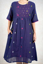 Raysham Fashion navy blue cotton midi dress with polka dots, vertical stitching, and pink sleeve trim.