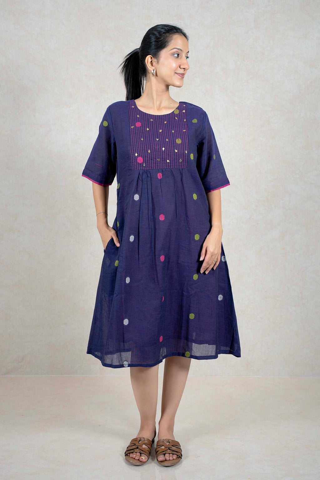 Raysham Fashion navy blue cotton midi dress with polka dots, vertical bodice stitching, and pink sleeve trim.