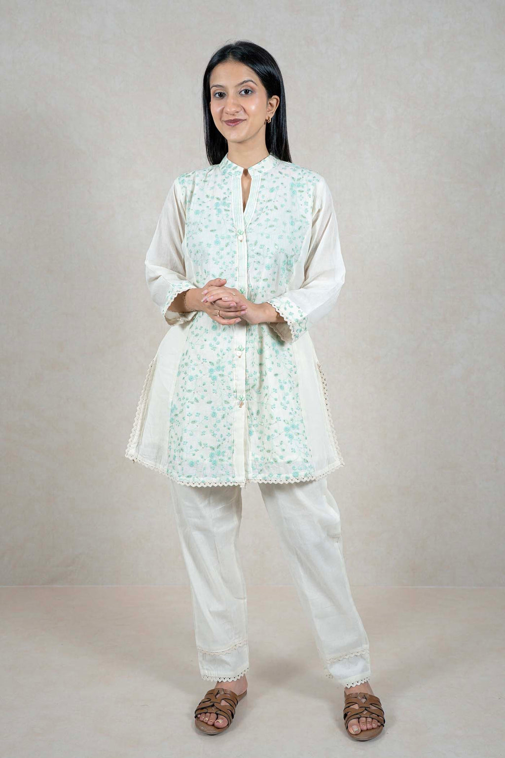 Raysham Fashion off-white cotton kurta set with mint green floral embroidery, mandarin collar, and scalloped lace trim.