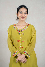 Raysham Fashion olive green kurta with multi-colored floral embroidery on the neckline and cuffs and lace trim.