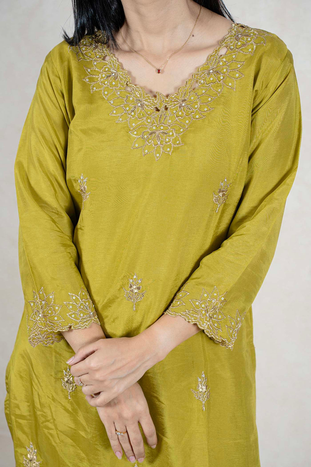 Raysham Fashion olive green silk blend kurta featuring intricate gold embroidery on the neckline and sleeve cuffs.
