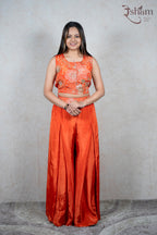 Raysham Fashion orange sleeveless crop top with floral embroidery and sequins paired with matching wide-leg trousers.
